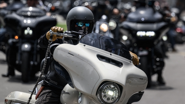 Switzerland's Hells Angels motorbike gang members leaves a courthouse after a trial in Bern, on June 30, 2022. - In total, 22 rival gang members of Hells Angels and Bandidos were judged for taking part in a fight at Belp near Bern, in May 2019 that resulted in numerous injuries. (Photo by Fabrice COFFRINI / AFP)