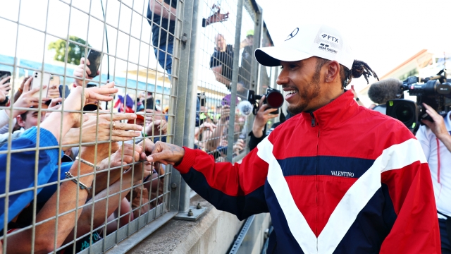 NORTHAMPTON, ENGLAND - JULY 03: Lewis Hamilton of Great Britain and Mercedes waves at fans following the F1 Grand Prix of Great Britain at Silverstone on July 03, 2022 in Northampton, England. (Photo by Clive Rose/Getty Images)
