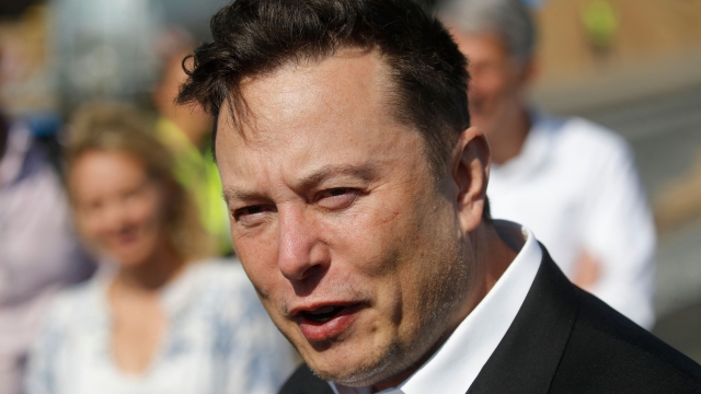 (FILES) In this file photo taken on September 3, 2020 Tesla CEO Elon Musk talks to media as he arrives to visit the construction site of the future US electric car giant Tesla,  in Gruenheide near Berlin. - Elon Musk pulled the plug on his deal to buy Twitter on July 8, 2022, accusing the company of "misleading" statements about the number of fake accounts, a regulatory filing showed (Photo by Odd ANDERSEN / AFP)
