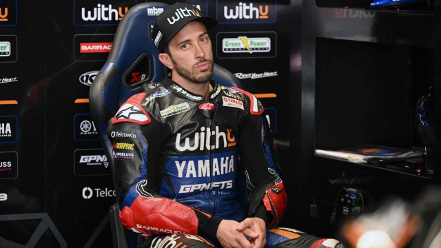 Yamaha RNF Italian rider Andrea Dovizioso sits in the box during the second MotoGP free practice session of the Moto Grand Prix de Catalunya at the Circuit de Catalunya on June 3, 2022 in Montmelo on the outskirts of Barcelona. (Photo by LLUIS GENE / AFP)