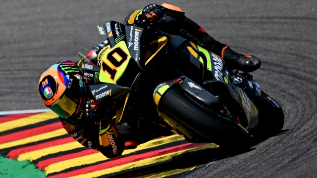 epa10020715 Luca Marini Mooney VR46 Racing Team in action during the free practice session of the motorcycling Grand Prix of Germany at the Sachsenring racing circuit in Hohenstein-Ernstthal, Germany, 18 June 2022. The Motorcycling Grand Prix of Germany takes place on 19 June.  EPA/FILIP SINGER