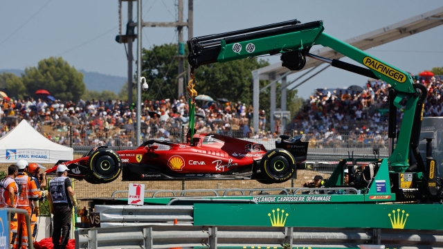 epa10089655 Stewards remove the racing car of Monaco's Formula One driver Charles Leclerc of Scuderia Ferrari during the Formula One Grand Prix of France at the Circuit Paul Ricard in Le Castellet, France, 24 July 2022.  EPA/ERIC GAILLARD / POOL