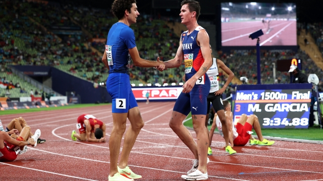 MUNICH, GERMANY - AUGUST 18: Pietro Arese of Italy interacts with Gold medalist Jakob Ingebrigtsen of Norway after the Athletics - Men's 1500m Final on day 8 of the European Championships Munich 2022 at Olympiapark on August 18, 2022 in Munich, Germany. (Photo by Maja Hitij/Getty Images)