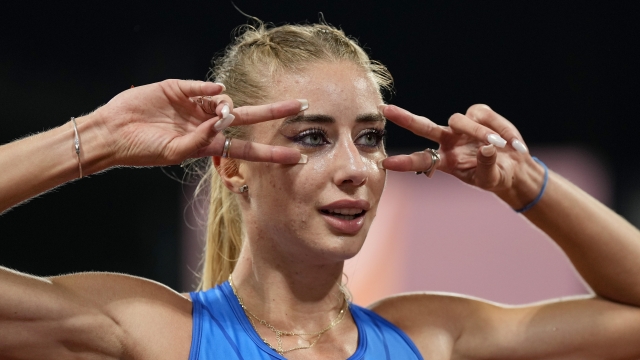 Gaia Sabbatini, of Italy, gestures after finishing the Women's 1500 meters during the athletics competition in the Olympic Stadium at the European Championships in Munich, Germany, Friday, Aug. 19, 2022. (AP Photo/Martin Meissner)