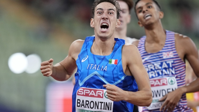Simone Barontini, of Italy, reacts as he crosses the finish line in second place in a Men's 800 meters semifinal during the athletics competition in the Olympic Stadium at the European Championships in Munich, Germany, Friday, Aug. 19, 2022. (AP Photo/Martin Meissner)
