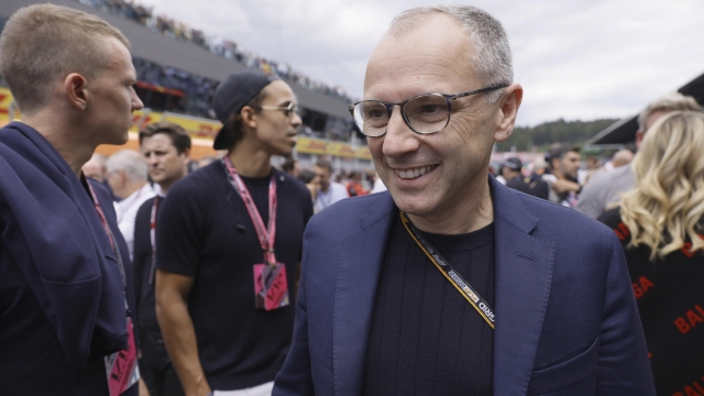 epa10063570 Stefano Domenicali, CEO of the Formula One Group walks on the starting grid ahead of the Formula One Grand Prix of Austria at the Red Bull Ring in Spielberg, Austria, 10 July 2022.  EPA/RONALD WITTEK