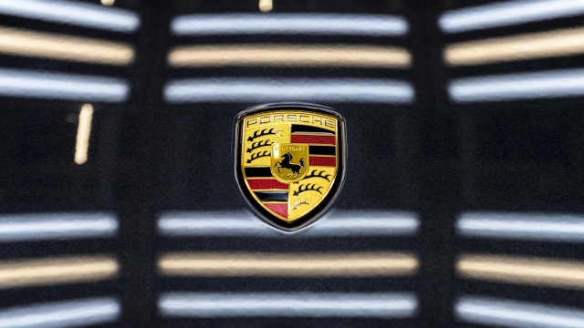 epa08271927 A view of a Logo at the production of Taycan electric sports cars at an assembly line at the German car manufacturer Porsche in Stuttgart, Germany, 05 March 2020. Porsche AG is a listed German manufacturer of luxury sports cars, SUVs and sedans based in Stuttgart. Porsche AG will present the results of the 2020 financial year at the annual press conference on 24 March 2020.  EPA/RONALD WITTEK