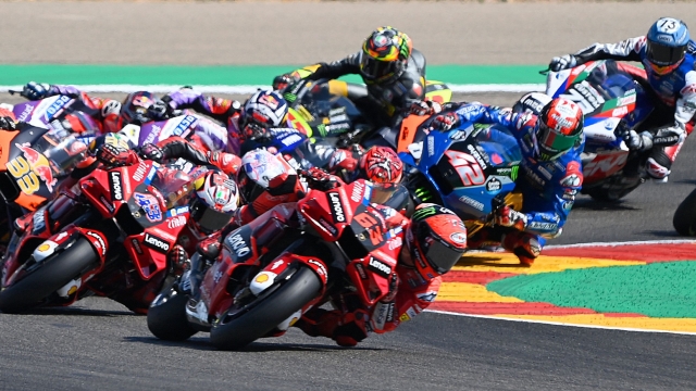 MotoGP riders compete during the Moto Grand Prix GP of Aragon at the Motorland circuit in Alcaniz on September 18, 2022. (Photo by PIERRE-PHILIPPE MARCOU / AFP)