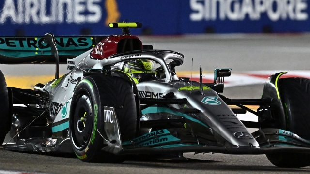 Mercedes' British driver Lewis Hamilton drives during the qualifying session ahead of the Formula One Singapore Grand Prix night race at the Marina Bay Street Circuit in Singapore on October 1, 2022. (Photo by Lillian SUWANRUMPHA / AFP)