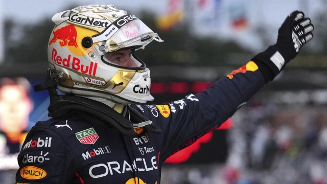 Red Bull driver Max Verstappen of the Netherlands celebrates his win during the Japanese Formula One Grand Prix at the Suzuka Circuit in Suzuka, central Japan, Sunday, Oct. 9, 2022. (AP Photo/Eugene Hoshiko)
