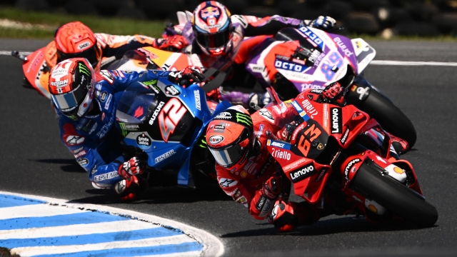 epa10246566 Francesco Bagnaia of Italy riding for Ducati Team (front) during the MotoGP race at the Australian Motorcycle Grand Prix at the Phillip Island Grand Prix Circuit on Phillip Island, Victoria, Australia, 16 October 2022.  EPA/JOEL CARRETT AUSTRALIA AND NEW ZEALAND OUT