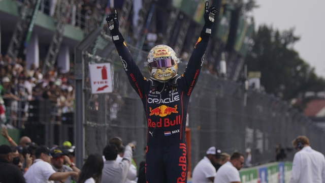 Red Bull driver Max Verstappen, of the Netherlands, celebrates winning the Formula One Mexico Grand Prix at the Hermanos Rodriguez racetrack in Mexico City, Sunday, Oct. 30, 2022. (AP Photo/Fernando Llano)