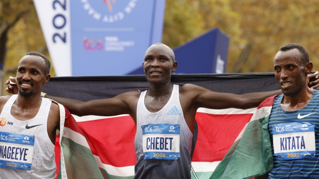 From left, men's division third place finisher Abdi Nageeye, of the Netherlands, winner Evans Chebet, of Kenya, and second place finisher Shura Kitata, of Ethiopia, pose at the finish line of the New York City Marathon, Sunday, Nov. 6, 2022, in New York. (AP Photo/Jason DeCrow)