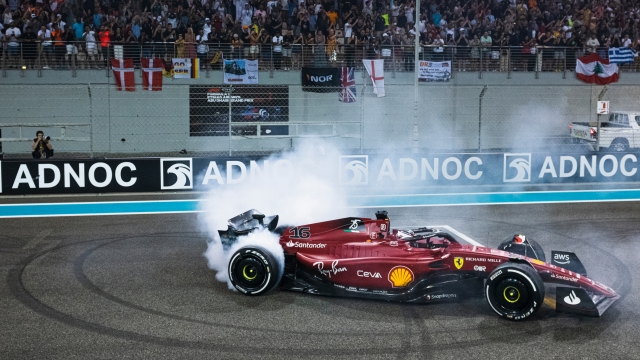 ABU DHABI, UNITED ARAB EMIRATES - NOVEMBER 20: Second placed Charles Leclerc of Monaco and Ferrari performs a celebratory donut in parc ferme following the F1 Grand Prix of Abu Dhabi at Yas Marina Circuit on November 20, 2022 in Abu Dhabi, United Arab Emirates. (Photo by Rudy Carezzevoli/Getty Images)