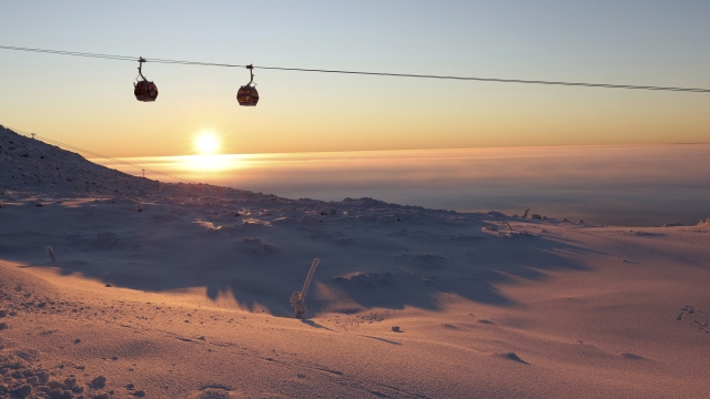 The sun rises over the course during an alpine ski, women's World Cup slalom, in Levi, Finland, Sunday, Nov. 20, 2022. (AP Photo/Alessandro Trovati)
