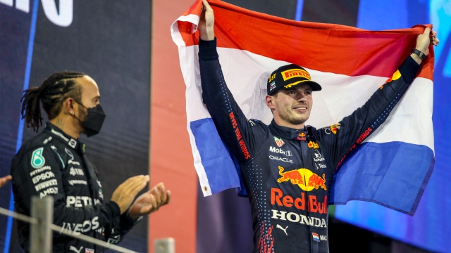 VERSTAPPEN Max (ned), Red Bull Racing Honda RB16B, portrait podium with HAMILTON Lewis (gbr), Mercedes AMG F1 GP W12 E Performance during the Formula 1 Etihad Airways Abu Dhabi Grand Prix 2021, 22th round of the 2021 FIA Formula One World Championship from December 10 to 12, 2021 on the Yas Marina Circuit, in Yas Island, Abu Dhabi - Photo Florent Gooden / DPPI (Photo by FLORENT GOODEN / DPPI / DPPI via AFP)