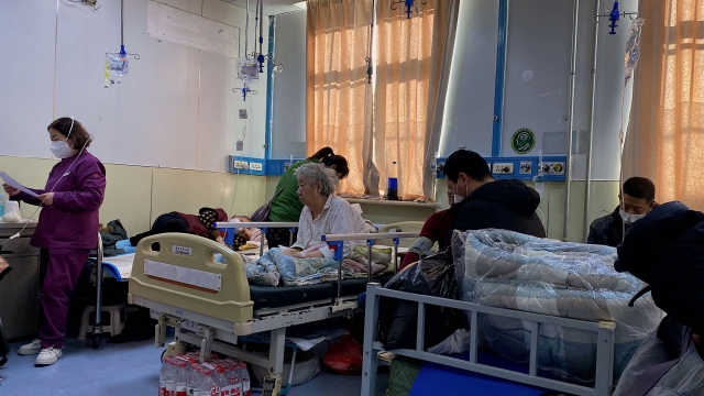 Patients with Covid-19 are pictured in beds at Tangshan Gongren Hospital in China's northeastern city of Tangshan on December 30, 2022. (Photo by Noel Celis / AFP)