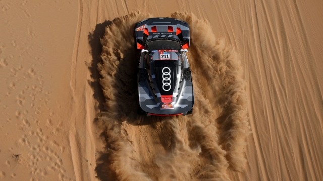 Swedish driver Mattias Ekstrom and his co-driver Emil Bergkvist of Sweeden steer their Audi's Hybrid during the Stage 10 of the Dakar 2023, between Haradh and Shaybah, Saudi Arabia, on January 11, 2023. (Photo by FRANCK FIFE / AFP)