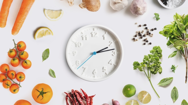 Clock surround with Food ingredient, vegetables and herbal. Dieting and healthy eating concept