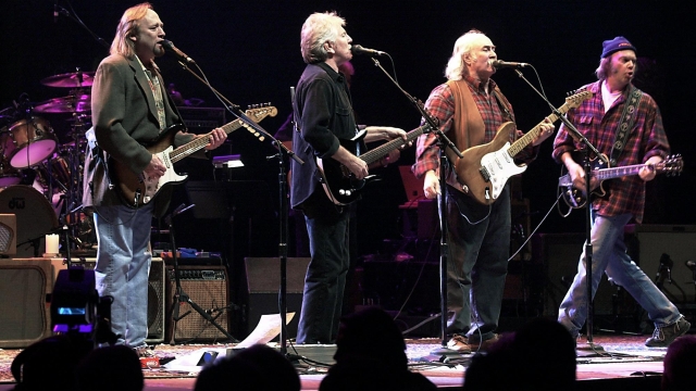 (FILES) In this file photo taken on January 24, 2000 Stephen Stills, (L) Graham Nash (2nd L), David Crosby (2nd R) and Neil Young (R) perform live for the first time since 1974 at the Palace of Auburn Hill, Michigan. - Folk-rock pioneer David Crosby dies on January 19, 2023, at 81, according to US media (Photo by JEFF KOWALSKY / AFP)