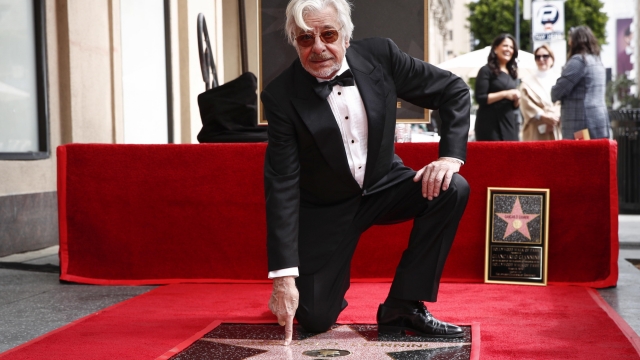 epa10506773 Italian actor Giancarlo Giannini kneels atop his newly unveiled Hollywood Walk of Fame star during a ceremony in his honor in Hollywood, California, USA, 06 March 2023.  EPA/CAROLINE BREHMAN