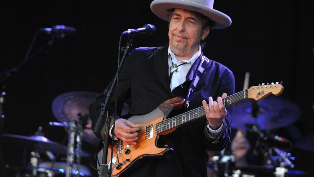(FILES) In this file photo taken on July 22, 2012 US legend Bob Dylan performs on stage during the 21st edition of the Vieilles Charrues music festival in Carhaix-Plouguer, western France. - A woman who sued Bob Dylan for allegedly sexually abusing her when she was 12 has dropped her case, just after the folk-rock artist's legal team accused her of destroying evidence. In August of last year the plaintiff, who remains unnamed and was identified only as J.C., had filed a suit alleging that Dylan abused her over a six-week period between April and May of 1965 (Photo by Fred TANNEAU / AFP)