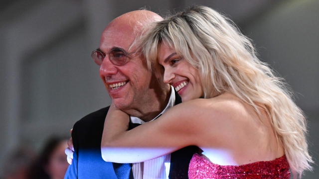 Italian director Paolo Virzi and his wife Italian actress Micaela Ramazzotti arrive on September 8, 2022 for the screening of the film "Siccita" presented out of competition as part of the 79th Venice International Film Festival at Lido di Venezia in Venice, Italy. (Photo by Tiziana FABI / AFP)