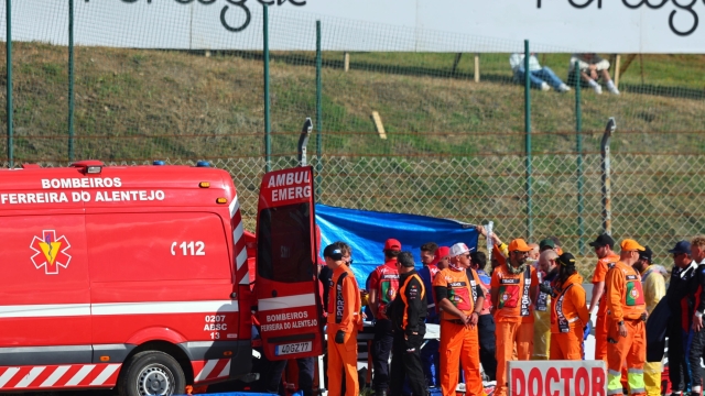 epa10541120 Spanish MotoGP rider Pol Espargaro of GASGAS Factory Racing Tech3 is assisted by a medical team after a fall during the second practice session for the the Motorcycling Grand Prix of Portugal at Algarve International race track, in Portimao, south of Portugal, 24 March 2023. The Motorcycling Grand Prix of Portugal will take place on 26 March 2023.  EPA/NUNO VEIGA