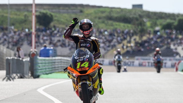 Third placed Kalex Italian rider Tony Arbolino celebrates after crossing the finish line of the Moto2 race of the Portuguese Grand Prix at the Algarve International Circuit in Portimao, on March 26, 2023. (Photo by PATRICIA DE MELO MOREIRA / AFP)