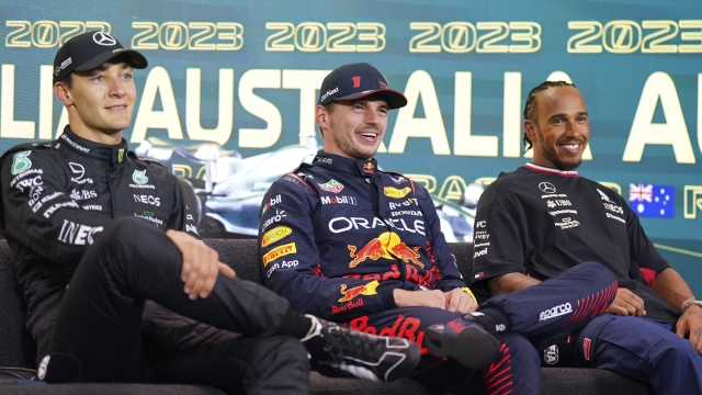 The top 3 fastest qualifiers, Mercedes driver George Russell of Britain, left, Red Bull driver Max Verstappen of Netherlands and Mercedes driver Lewis Hamilton of Britain, right, attend a press conference ahead of the Australian Formula One Grand Prix at Albert Park in Melbourne, Saturday, April 1, 2023. Verstappen qualified fasted, Russell second and Hamilton is 3rd. (AP Photo/Asanka Brendon Ratnayake)
