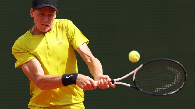 MONTE-CARLO, MONACO - APRIL 12: Jannik Sinner of Italy plays a backhand against Diego Schwartzman of Argentina in their second round match during day four of the Rolex Monte-Carlo Masters at Monte-Carlo Country Club on April 12, 2023 in Monte-Carlo, Monaco. (Photo by Clive Brunskill/Getty Images)