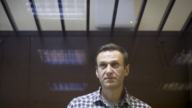 FILE - Russian opposition leader Alexei Navalny stands in a cage in the Babuskinsky District Court in Moscow, Russia on Feb. 20, 2021. Navalny said in a social media post published Wednesday Feb. 1, 2023 that prison authorities have put him in a one-man cell for the next six months. (AP Photo/Alexander Zemlianichenko, File)