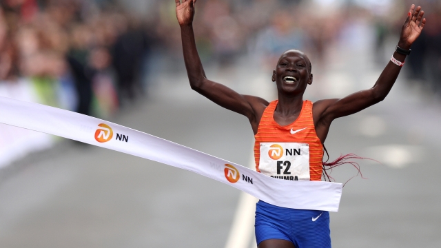 ROTTERDAM, NETHERLANDS - APRIL 16: Eunice Chumba of Bahrain crosses the Finish Line to win and take the gold medal or 1st place in the Women's Rotterdam Marathon 2023 on April 16, 2023 in Rotterdam, Netherlands. (Photo by Dean Mouhtaropoulos/Getty Images)