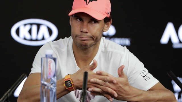 FILE - In this Jan. 23, 2018, file photo, Spain's Rafael Nadal answers questions at a press conference after retiring injured from his quarterfinal against Croatia's Marin Cilic at the Australian Open tennis championships in Melbourne, Australia. Rafael Nadal pulled out of the upcoming Indian Wells hard-court tournament on Tuesday, Feb. 28, 2023, because of the left hip flexor injury that has sidelined him since the Australian Open. (AP Photo/Mark Baker, File)