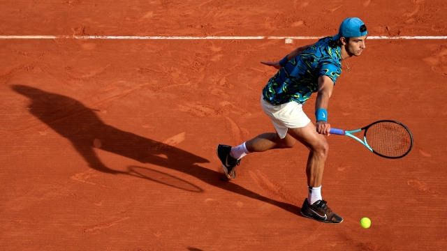 Italy's Lorenzo Musetti returns the ball to Italy's Jannik Sinner during the Monte-Carlo ATP Masters Series tournament quarter final tennis match in Monte Carlo on April 14, 2023. (Photo by Valery HACHE / AFP)