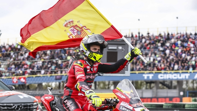 Spain's Alvaro Bautista celebrates with a Spanish flag on his Ducati after winning the World Supersport Championship race at TT Circuit Assen race track on April 23, 2023. (Photo by Vincent Jannink / ANP / AFP) / Netherlands OUT