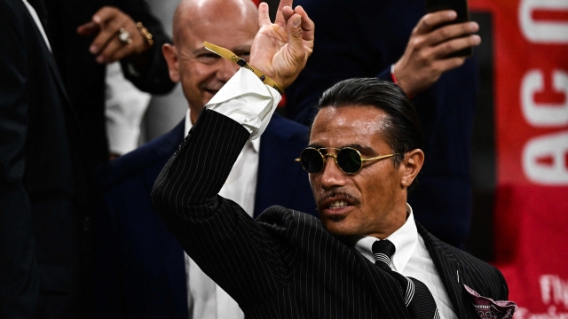 Turkish butcher, chef, food entertainer and restaurateur, Nusret Gokçe, nicknamed Salt Bae, attends the Italian Serie A football match between AC Milan and Napoli on September 18, 2022 at the San Siro stadium in Milan. (Photo by MIGUEL MEDINA / AFP)