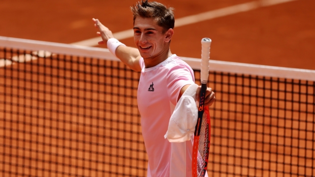 MADRID, SPAIN - APRIL 28: Matteo Arnaldi of Italy celebrates winning match point against Casper Ruud of Norway during the Men's Singles second round match on Day Five of the Mutua Madrid Open at La Caja Magica on April 28, 2023 in Madrid, Spain. (Photo by Clive Brunskill/Getty Images)