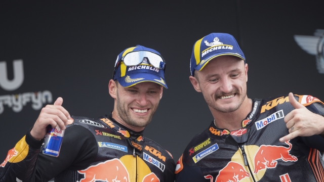 JEREZ DE LA FRONTERA, SPAIN - APRIL 30: (L-R) Brad Binder of South Africa and Red Bull KTM Factory Racing  and Jack Miller of Australia and Bull KTM Factory Racing  celebrate on the podium during the MotoGP race during the MotoGP Of Spain - Race on April 30, 2023 in Jerez de la Frontera, Spain. (Photo by Mirco Lazzari gp/Getty Images)