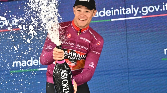 Italian rider Jonathan Milan of team Bahrain Victorious wearing the points classification leader's celebrate on the podium after eighth stage of the 2023 Giro d'Italia cycling race over 207 km from Terni to Fossombrone, Italy, 13 May 2023. ANSA/LUCA ZENNARO
