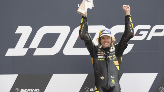 LE MANS, FRANCE - MAY 14: Marco Bezzecchi of Italy and Mooney VR46 Racing Team celebrates the victory on the podium at the end of the MotoGP race during the MotoGP of France - Race on May 14, 2023 in Le Mans, France. (Photo by Mirco Lazzari gp/Getty Images)