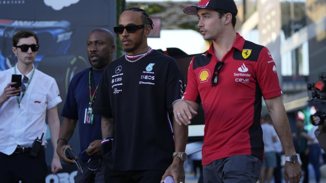 Mercedes driver Lewis Hamilton of Britain, left, and Ferrari driver Charles Leclerc of Monaco arrive to speak to media ahead of the Formula On Saudi Arabian Grand Prix in Jeddah, Saudi Arabia, Thursday, March 16, 2023. (AP Photo/Hassan Ammar)