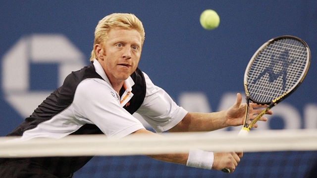 (FILES) In this file photo taken on September 7, 2002 Boris Becker of Germany chases down a backhand from John McEnroe during an exhibition game at the US Open Tennis Tournamen at Flushing Meadows, NY. - Former tennis superstar Boris Becker has been released from prison after serving a sentence relating to his 2017 bankruptcy, British media said on December 16, 2022. The domestic Press Association news agency said the 55-year-old six-time Grand Slam champion will now be deported from the UK, following earlier reports in the German press. (Photo by STAN HONDA / AFP)