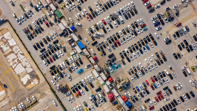 This aeiral photo taken on May 17, 2023 shows cars parked at a second-hand car market in Zhengzhou, in China's central Henan province. (Photo by AFP) / China OUT