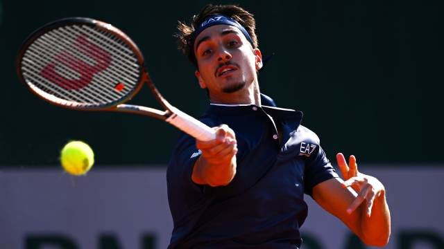 PARIS, FRANCE - MAY 28: Lorenzo Sonego of Italy plays a forehand against Ben Shelton of United States during their Men's Singles First Round match on Day One of the 2023 French Open at Roland Garros on May 28, 2023 in Paris, France. (Photo by Clive Mason/Getty Images)