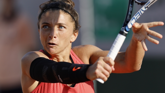 Italy's Sara Errani plays a shot against Switzerland's Jil Teichmann during their first round match of the French Open tennis tournament at the Roland Garros stadium in Paris, Sunday, May 28, 2023. (AP Photo/Jean-Francois Badias)
