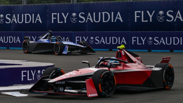 Maserati MSG Racing's Formula E German driver Maximilian Gunther (L) and  Avalanche Andretti's Formula E German driver Andre Lotterer (R) compete in the qualifying of the Formula E race at the Jakarta International e-Prix Circuit in Jakarta on June 3, 2023. (Photo by BAY ISMOYO / AFP)