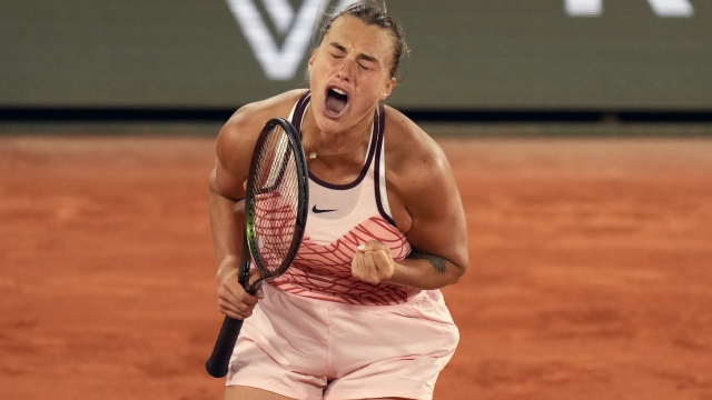 Aryna Sabalenka of Belarus celebrates after beating Sloane Stephens of the U.S. during their fourth round match of the French Open tennis tournament at the Roland Garros stadium in Paris, Sunday, June 4, 2023. (AP Photo/Thibault Camus)