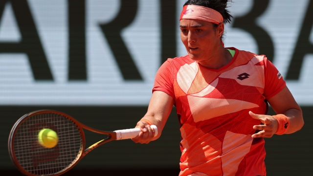 PARIS, FRANCE - JUNE 05: Ons Jabeur of Tunisia plays a forehand against Bernarda Pera of United States during the Women's Singles Fourth Round match on Day Nine of the 2023 French Open at Roland Garros on June 05, 2023 in Paris, France. (Photo by Julian Finney/Getty Images)