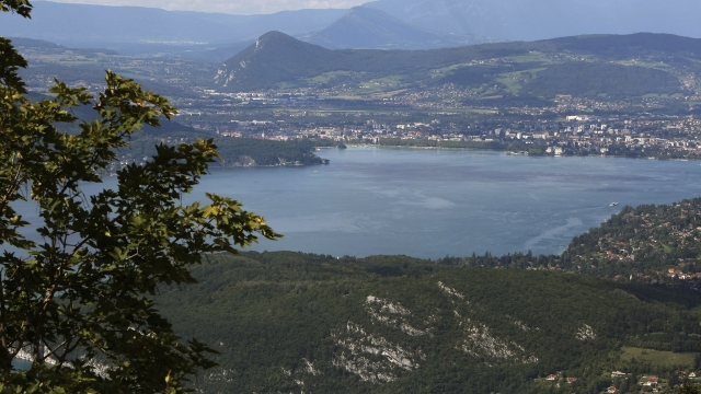 FILE - View of the lake of Annecy, French Alps, Friday, Sept.10, 2010. France's interior minister Gerald Darmanin says Thursday June 8, 2023 that an attacker with a knife injured children and others in a town in Annecy, French Alps. In a short tweet, he said police have detained the attacker. (AP Photo/Lionel Cironneau, File)